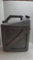 Gray 6-gallon Reliance heavy-duty water container with embossing and two black caps