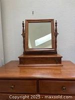 Photo showing the Ethan Allen tabletop shaving mirror on the dresser, highlighting the adjustable tilt mirror with decorative wooden spindles on each side and two small drawers beneath the mirror.