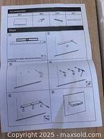 Instruction sheet showing the included accessories and steps for assembling and mounting the floating shelf with drawer.