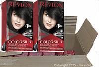 Two boxes of Revlon Colorsilk Beautiful Color permanent hair dye in black displayed on top of an open cardboard box filled with more boxes of the same product.