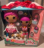 Front view of original packaging showing two Lalaloopsy Princess dolls, three pets, and castle playset.