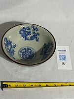 Top view of the antique Chinese blue dragon porcelain bowl showing the detailed blue dragon motifs on the interior and the rim.