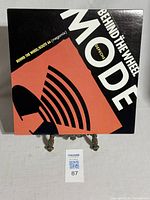 Front side of the vinyl record sleeve showing the title 'Depeche Mode Behind The Wheel/Route 66 Megamix' with a red-orange and black graphic design.