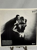 Back sleeve of the vinyl record showing a black and white artistic image along with text and barcode.