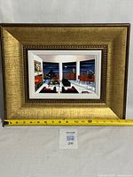 Full view of framed print with measuring tape