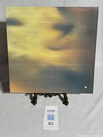 Front side of vinyl record sleeve with abstract blurred gradient design in yellow, orange, and green tones.