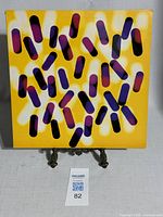 Front cover of the vinyl record sleeve showing abstract design with yellow, purple, and black elements.