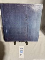 Photo of the record cover front side with blue textured design and 1986 text