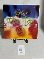 Front view of the album sleeve for The Cure's The Top with vibrant, psychedelic artwork.