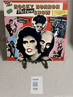 Front cover of The Rocky Horror Picture Show vinyl LP featuring colorful movie character illustrations and promotional text.