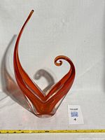 Front view showing the flame shape and size presence of the orange and clear glass