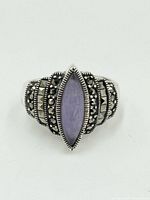 Top view showing marquise-shaped purple jadeite stone and marcasite embellishments on sterling silver ring.