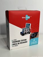 Front of box showing Blue Hive brand, 4 ports, and charging station image.