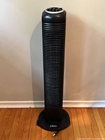 Full front view of the black Classic tower fan showing height and front grille design.
