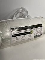 Packaging of Dream Bamboo Memory Foam Pillow showing logo and product details