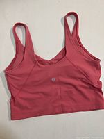 Front view of pink Lululemon Align tank top showing wide straps and logo.