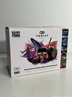 Front of Vodiac VR headset box showing brand, product type, and immersive entertainment theme with colorful VR graphics
