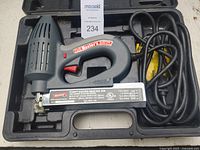 Arrow ET200 Electric Brad Nail Gun inside carrying case showing power cord and gun body