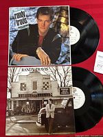 Both LP albums and covers of Always and Forever (1987) and Storms of Life (1986) by Randy Travis showing front covers and vinyl discs.