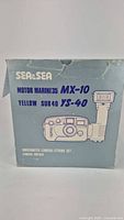 Photo showing the original blue Sea & Sea box with the model names MX-10 and Yellow Sub 40 YS-40 strobe printed on it, along with an illustration of camera with attached strobe.