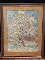 Front view of framed print showing blossoming peach tree scene