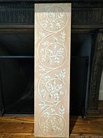 Full front view of the Italian fresco painting showing the pink background and acorn vine design in circular patterns.