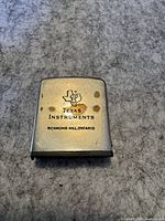 Front side of the lighter showing Texas Instruments logo and text.