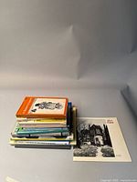 Stack of seven Canadian art books including artists Emily Carr, Group of Seven, Tom Thomson, and AGO publications.