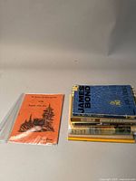 Top view of the stack of books showing titles and top book's cover