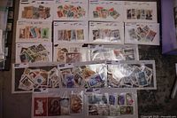 Overview of 16 stock cards displaying various older Russian stamps, laid out on a flat surface.