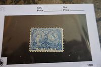 Front of the 1897 Canadian 50 cent Queen Victoria Jubilee stamp in blue with portraits of Queen Victoria.