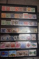 Stock sheet showing multiple rows of older and newer Chinese stamps in various colors and subjects including portraits, architecture, animals, and cultural icons.