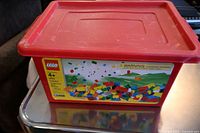 Red LEGO bin with lid, labeled LEGO Creator 4+ set 4400 with illustration of colorful bricks