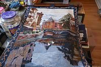 Full front view of the Venice scene tapestry showing buildings, bridge, canal with swans, and reflection in water