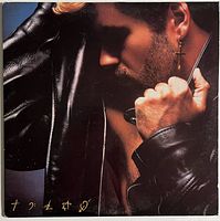 Front cover portrait of George Michael on Faith album