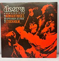 Front cover showing album title and concert image