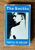 Front view of cassette case showing album cover