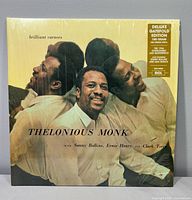 Front cover in shrink showing title and artist