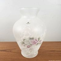 Front view of frosted glass vase showing white swirl marble-like finish and pastel rose floral decal with Arte Murano label.