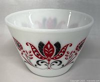 Front angled view showing the floral decal design on milk glass bowl.