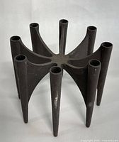 Front angled view showing the eight tapered candle holders and overall geometric design.