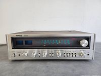 Front view of receiver showing tuner display, meters and control knobs