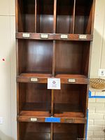 Front close view showing four top compartments and metal label holders