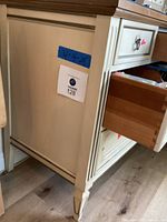 Side view of dresser showing measurements sticker (32x56x20) and drawer pulled out, revealing interior.