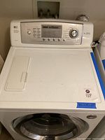 Top view showing control panel with buttons, cycle dial and lid