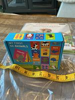 Rear and side view of boxed animal flashcards set showing colorful animal illustrations and box branding