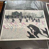 Photo of the entire poster showing silhouettes of people with a map background and tour date details.