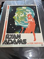 Front view of the 2014 Ryan Adams concert poster showing stylized artwork and Japanese text.