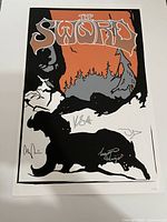 Front view of the autographed limited edition poster with band name, artwork, and signatures.