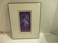 Framed artwork showing the full piece with white double mat and black frame.